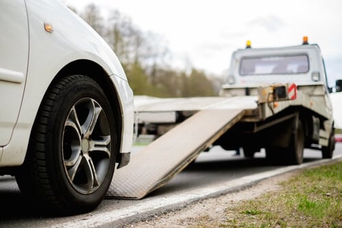 Car being loaded on trailer