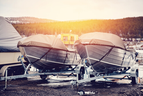 Two boats on trailers at sunset