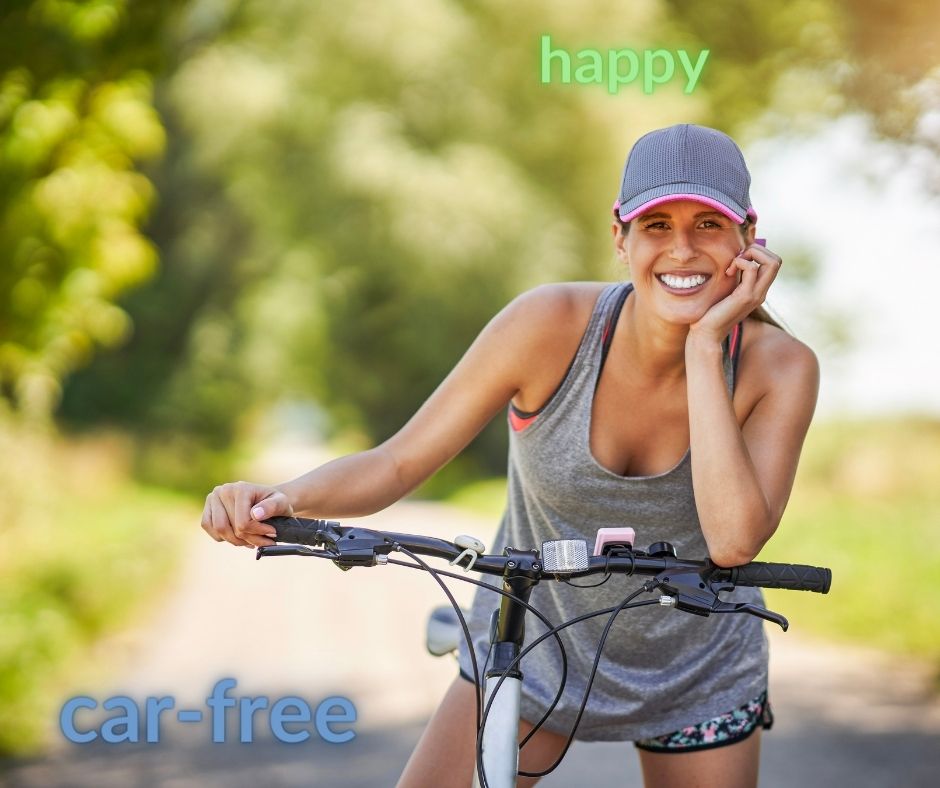 "A happy cyclist enjoying the car-free lifestyle.