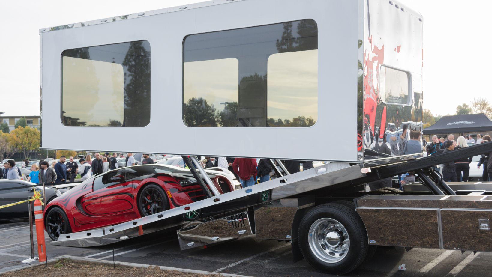 A secured car inside an enclosed transport truck.