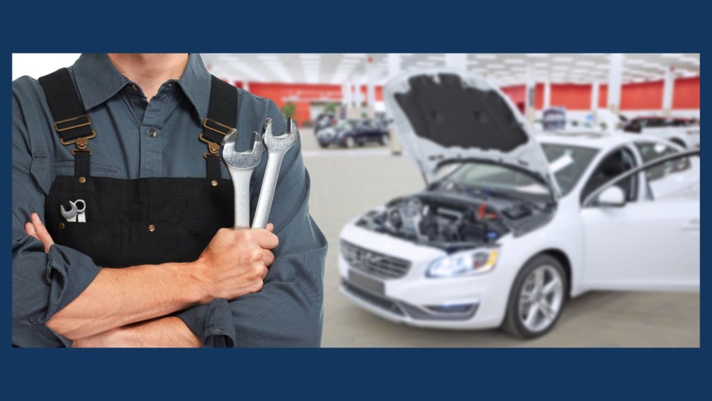 Professional mechanic repairing car damage