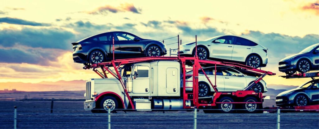 Cars ready for long-distance auto transport at dusk